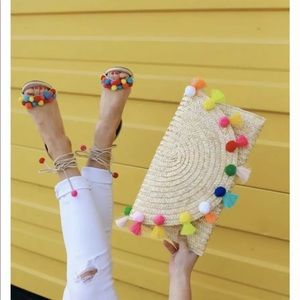 Straw pom pom and tassel clutch